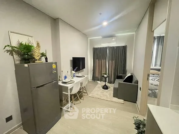 Modern compact living room with dining area and stylish decor