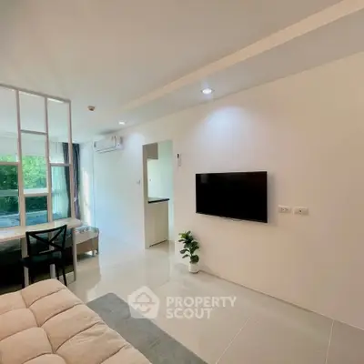Modern living room with wall-mounted TV and large window view