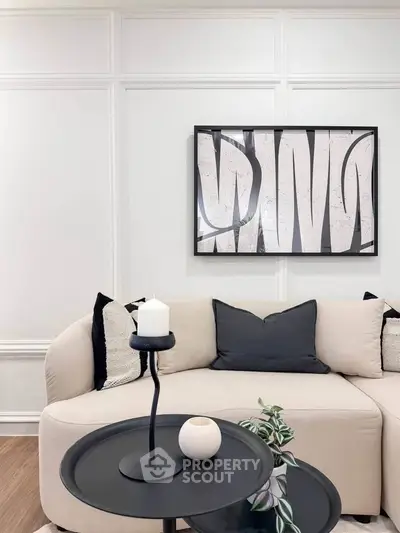 Stylish modern living room with elegant decor and cozy seating area.