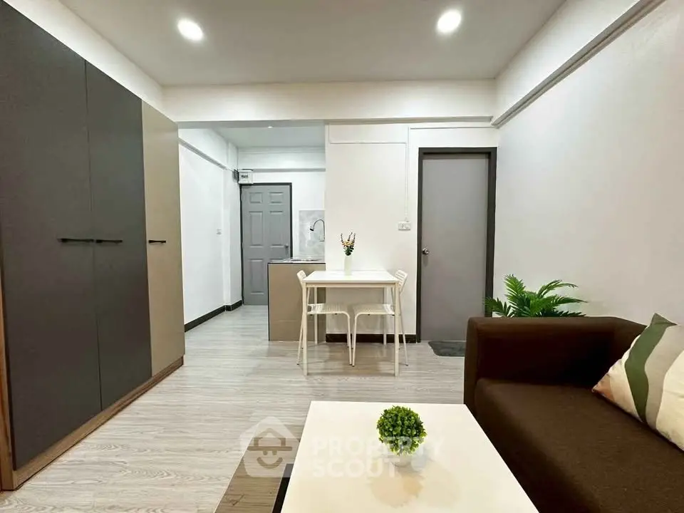 Modern living room with sleek furniture and stylish decor in a cozy apartment.