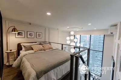 Modern loft bedroom with large windows and city view, featuring stylish decor and cozy ambiance.