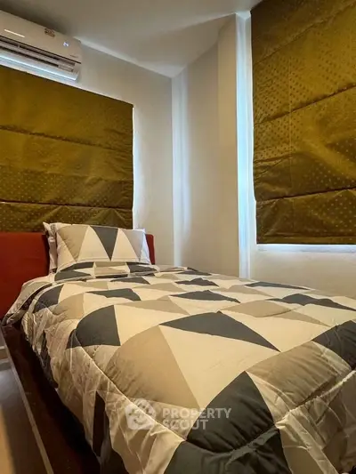 Cozy bedroom with modern geometric bedding and natural light