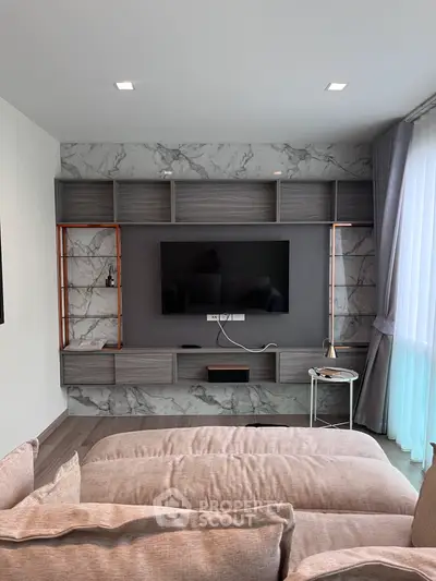 Modern living room with stylish TV wall unit and cozy seating area