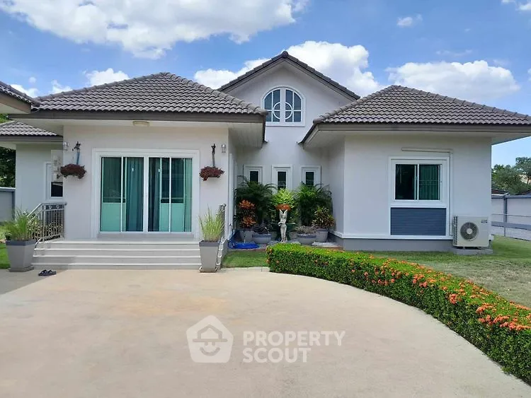 Charming suburban home with manicured garden and modern architecture.