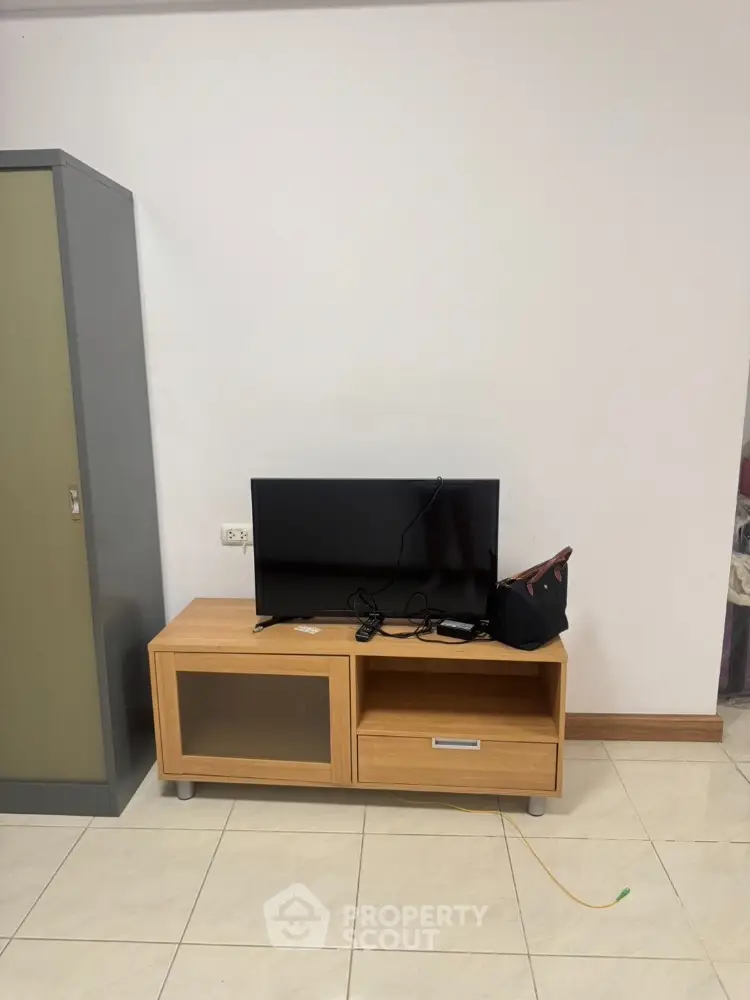 Modern living room with sleek TV stand and flat-screen television