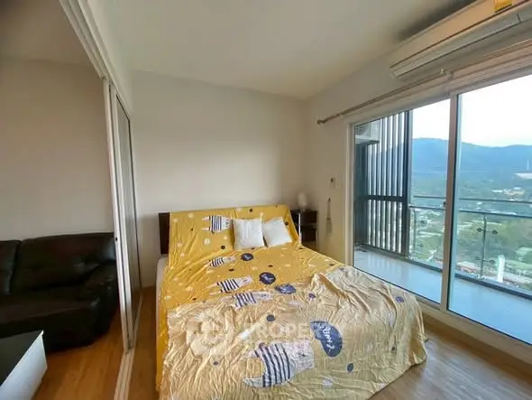 Cozy bedroom with mountain view and balcony access in modern apartment