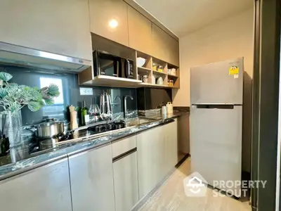 Modern kitchen with sleek cabinetry and stainless steel appliances