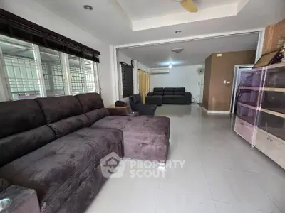 Spacious living room with modern furniture and ample natural light