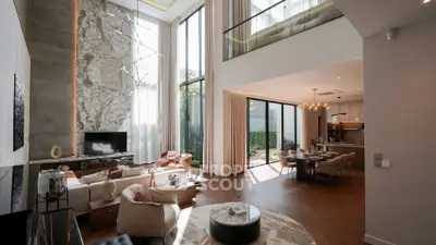 Luxurious modern living room with high ceilings and elegant decor