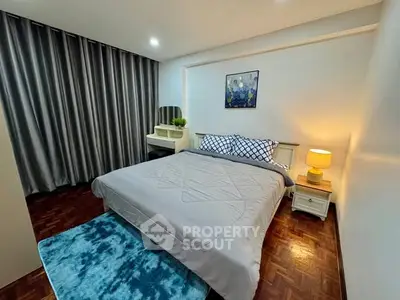 Cozy bedroom with stylish decor and modern furnishings, perfect for relaxation.