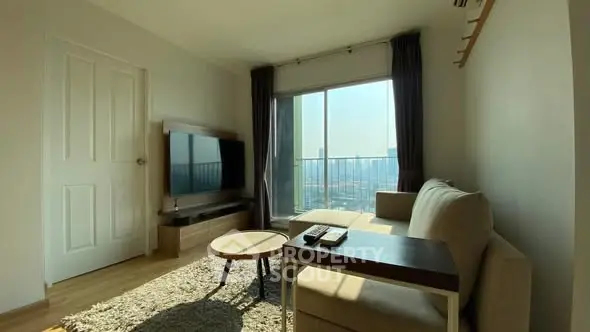 Bright living room with modern furniture and city view balcony.