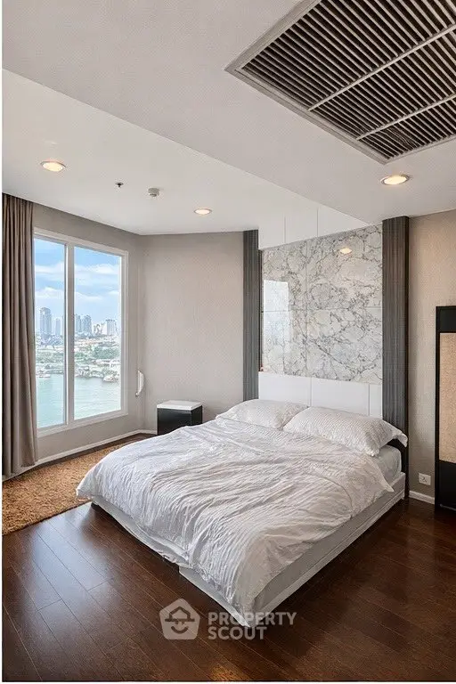 Luxurious bedroom with stunning city view and elegant decor