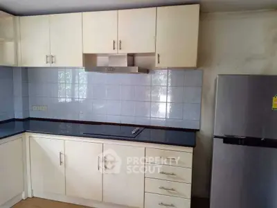 Spacious kitchen with modern cabinetry and stainless steel appliances