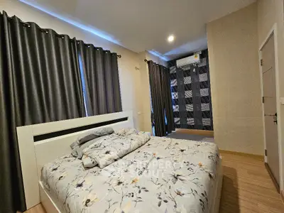 Spacious bedroom with modern decor and ample natural light
