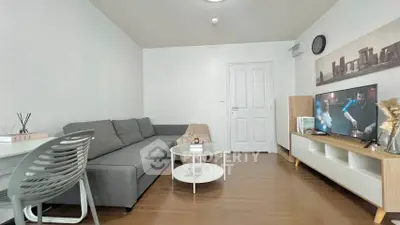 Modern living room with sleek furniture and stylish decor, perfect for relaxation and entertainment.