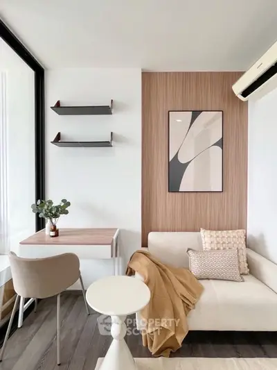 Modern living room with stylish decor and cozy seating area.