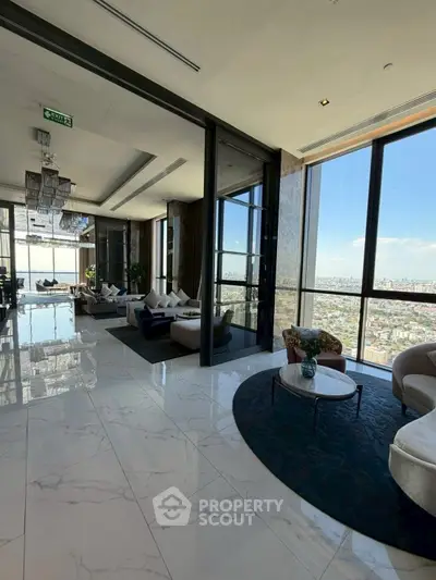 Luxurious high-rise living room with panoramic city views and elegant modern decor.