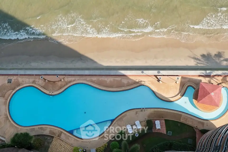 Stunning beachfront pool with ocean view in luxury real estate property.