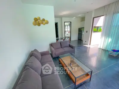 Spacious modern living room with sleek furniture and natural light