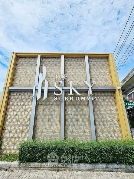 Modern exterior facade of The Sky Sukhumvit with intricate geometric design and lush greenery.