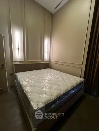 Luxurious bedroom with modern lighting and elegant wall paneling