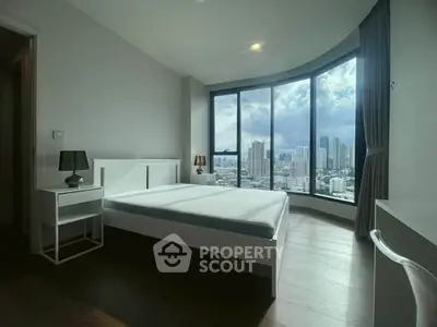 Modern bedroom with panoramic city view and stylish furnishings