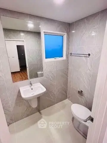 Modern bathroom with sleek design and large mirror