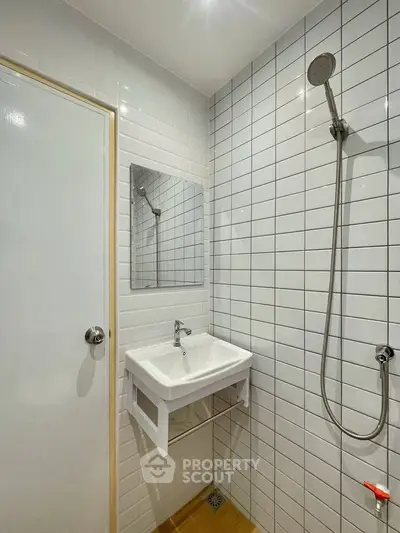 Modern bathroom with white subway tiles and sleek fixtures