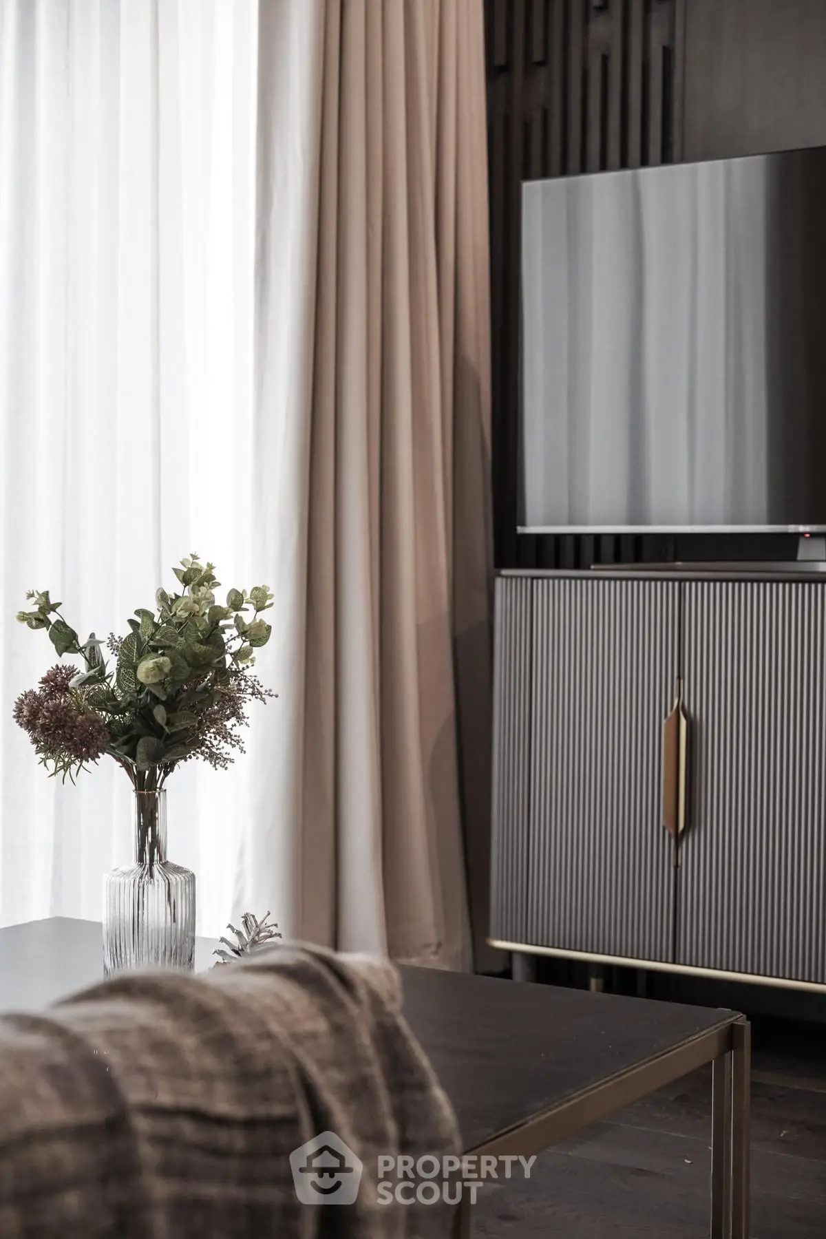 Elegant living room with modern decor and stylish TV cabinet