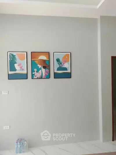 Minimalist interior wall with modern art and marble flooring