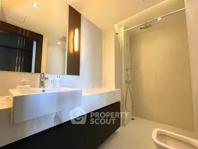 Luxurious modern bathroom with sleek fixtures and elegant lighting