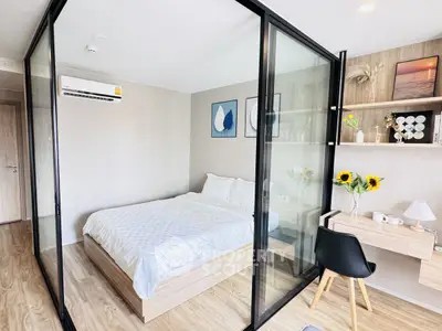 Modern bedroom with glass partition and stylish decor