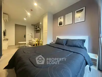 Modern bedroom with stylish decor and cozy ambiance in a contemporary apartment.