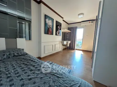 Spacious bedroom with modern decor and balcony access