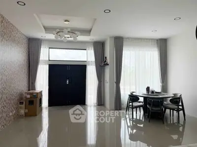 Spacious modern dining area with large windows and elegant decor