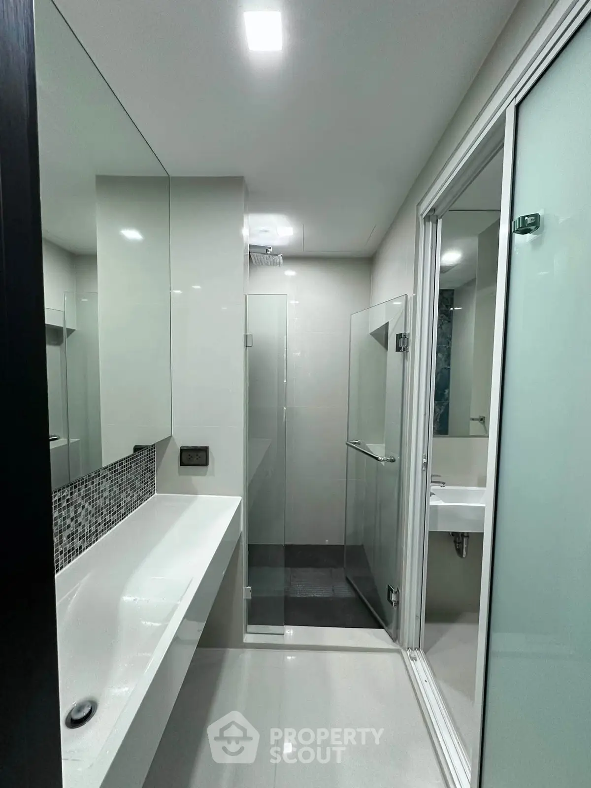 Modern bathroom with sleek design and glass shower enclosure