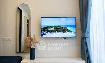 Modern living room with wall-mounted TV and elegant decor