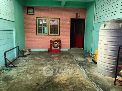 Charming home entrance with colorful walls and unique decor, perfect for a cozy living experience.