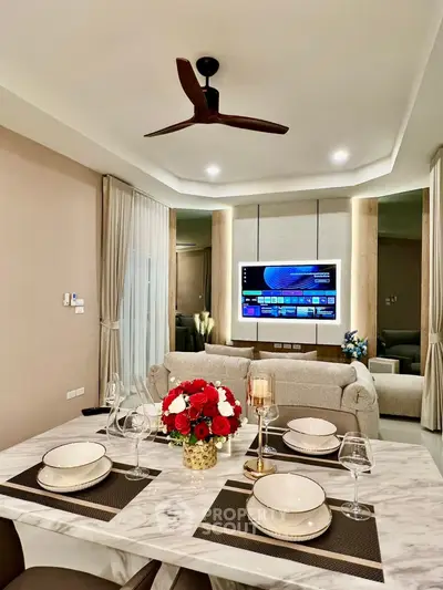 Luxurious modern living room with elegant dining setup and smart TV