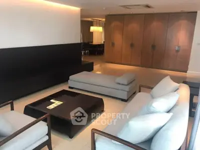 Spacious modern living room with elegant furniture and ambient lighting