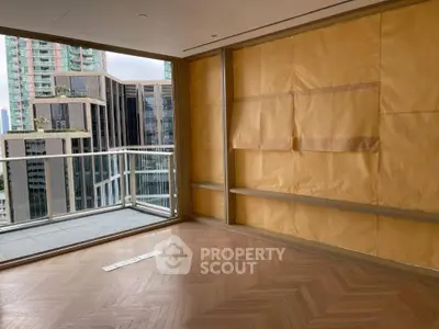 Spacious modern apartment with balcony and city view, featuring elegant parquet flooring.