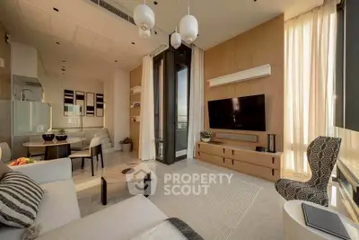 Modern living room with stylish decor, large windows, and open layout for a spacious feel.