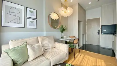 Modern living room with stylish decor and cozy seating in a contemporary apartment.