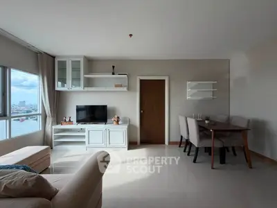 Spacious living room with modern furniture and stunning city view