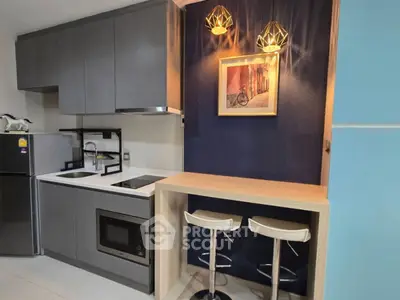 Modern kitchen with sleek cabinets and stylish lighting