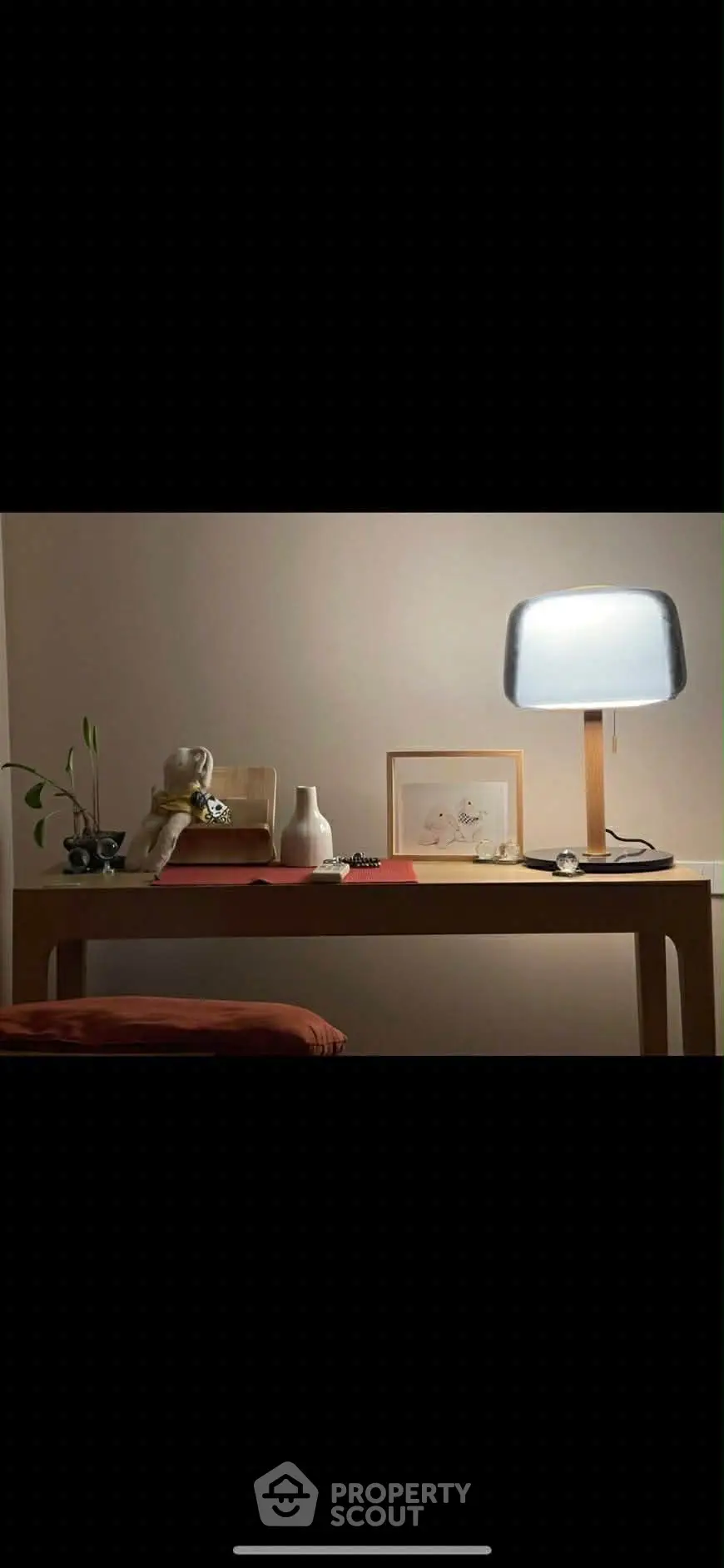 Elegant study nook with modern lamp and minimalist decor, perfect for a serene workspace.