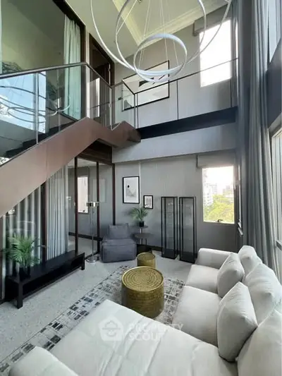 Luxurious modern living room with high ceilings and stylish decor