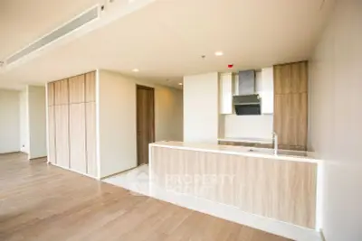 Spacious modern kitchen with sleek wooden cabinetry and open layout design.