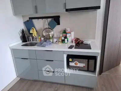 Modern kitchen with sleek cabinetry and built-in appliances