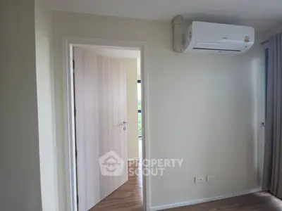 Modern interior with air conditioning and wooden flooring, perfect for comfortable living.